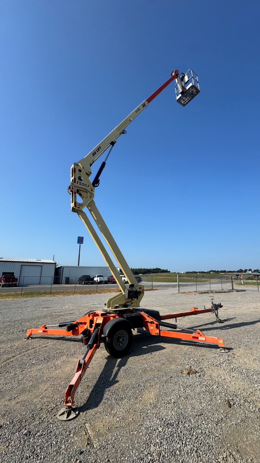 Readyline towable boom lift fully extended at the rental yard