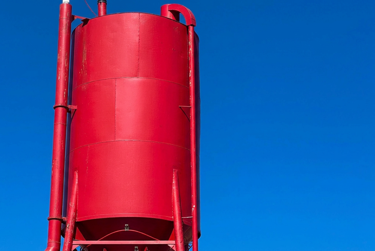 Full red silo at the coming Readyline Redi-Mix concrete plant in Eufaula
